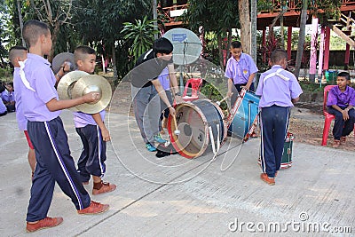 Asian teacher is teaching the music note for student group. Editorial Stock Photo